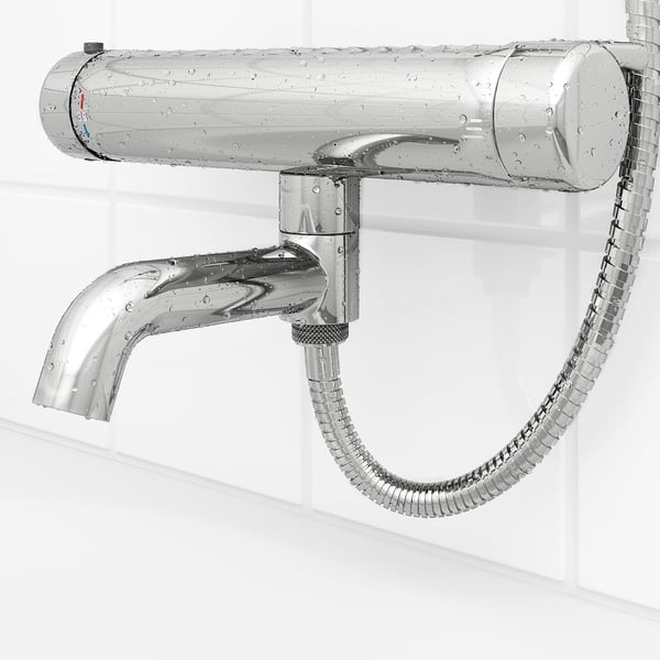 Chrome shower system with flexible hose and adjustable spout. Safety stop at 38°c, anti-scald feature.