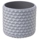 Variant: Rund, grå betongplantering med texturerad skaldesign, platt botten.