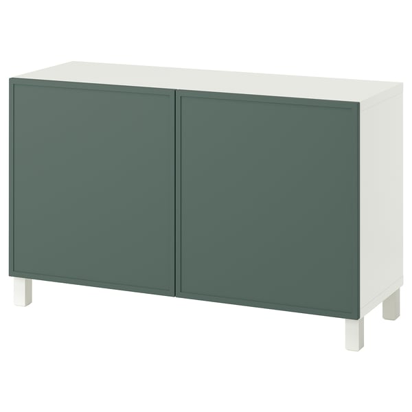 En ikea BESTÅ sideboard i grönt och vitt med två dörrar och fyrkantiga ben.
