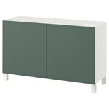 En ikea BESTÅ sideboard i grönt och vitt med två dörrar och fyrkantiga ben.