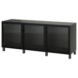 Svart BESTÅ-sideboard med tre glasdörrar, smala ben och strukturdörrar.
