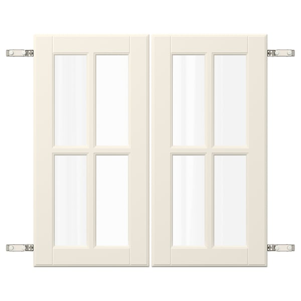 Ett par vita köksluckor BODBYN. De är rektangulära med en paneldesign med glasinsatser.