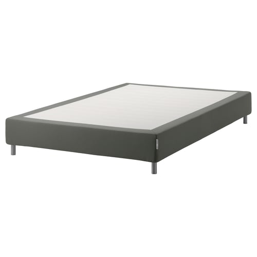 En espevar grå stoppad sängbotten med träribbor och metallben, designad för att stödja en madrass.