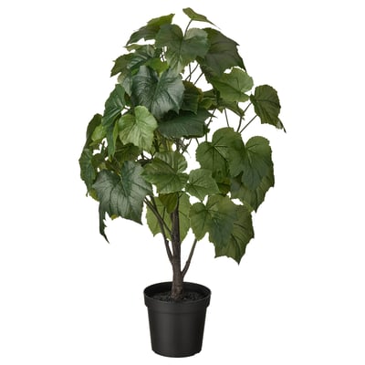 FEJKA: svart krukväxt med gröna blad. Artificiell, verklighetstrogen design.