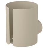 FLORSJÖN beige cylindrisk vägghållare, tillverkad av stål, med dekorativa utskärningar och en adapter i rostfritt stål.