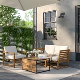 Acacia-patio-set, metallbord, vadderade stolar, matta, växt, vägglampa