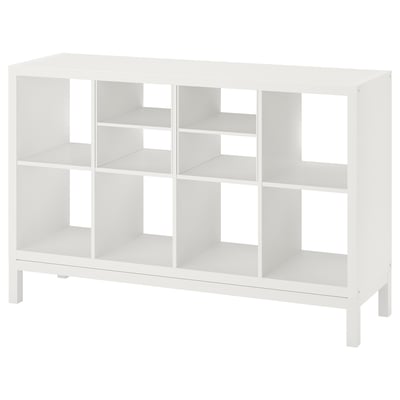 Vit ikea KALLAX hylla för förvaring. Minimalistisk design med kuber och stålram.