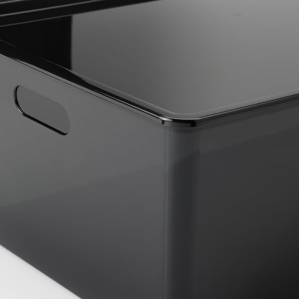 Svart förvaringslåda med elegant handtag som visar upp högkvalitativ finish och robust design.