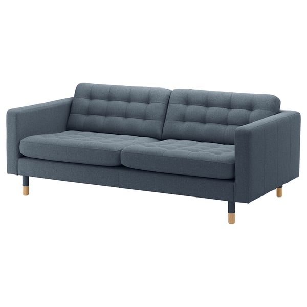 Blågrå tygsoffa, tuftad design, träben, mysigt och snyggt.