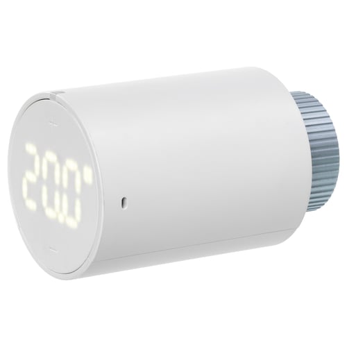LILJEBAGGE, vit cylindrisk termostat med digital display, silvermutter, minimalistisk design.