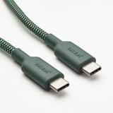 Två usb-c-kablar med grön textur på utsidan, märkta jinsai, visar upp en hållbar, flexibel design.