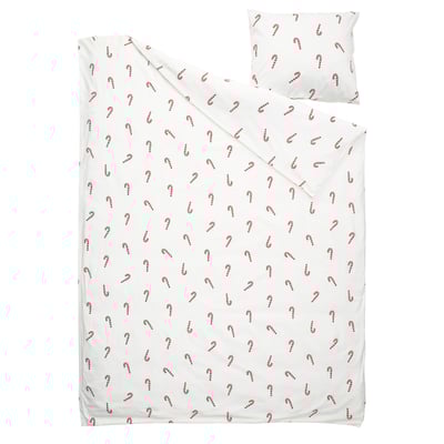 Vitt påslakanset med rött polkagristryck, mjuk bomull, semestertema.