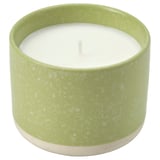 Grönt keramiskt ljus med vitt vax, cylindrisk form, spräcklig design, zoo.