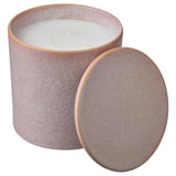 En beige keramisk ljusburk med lock, tre vita vekar, med en spräcklig design, perfekt för romantisk heminredning.