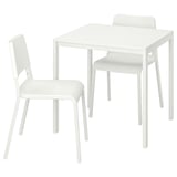 Liten vit matgrupp med fyrkantigt bord och två stolar, elegant modern design.