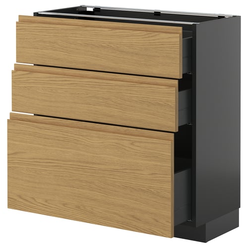 Köksskåp i trä med tre lådor och svarta sidor, snygg design.