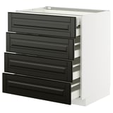 Ett vitt METOD köksskåp med fyra svarta lådor med fasade kanter. Den har en modern, elegant design.
