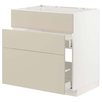 Den här bilden visar ett beige METOD-köksskåp med två lådor, med en elegant, modern design.
