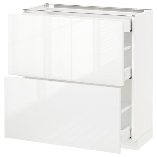 Vitt högglansigt ikea METOD köksskåp med flera lådor.