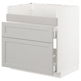 Ett ikea METOD ljusgrått köksskåp med fasade kanter och lådor.