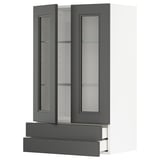 Modern köksmöbel med grå glasluckor och lådor, med en elegant design för förvaring.