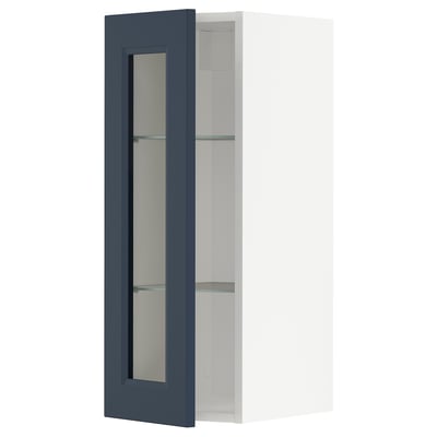 Modernt mörkblått skåp med glasdörr, slimmad design.