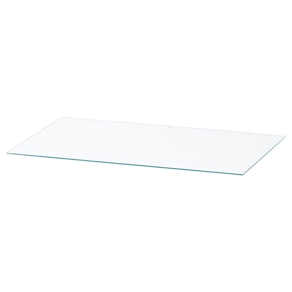 En rektangulär bordsskiva i glas som heter NORDLI. Den är klar och gjord av härdat glas.