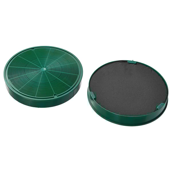 Två gröna runda kolfilter. Den ena är öppen med strukturer, den andra täckt av nät.