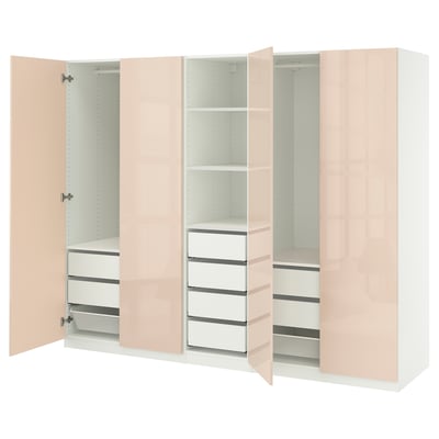 Den här bilden visar en ljusrosa PAX-garderob med lådor och hyllor. Den har en elegant, modern design med flera fack för förvaring.