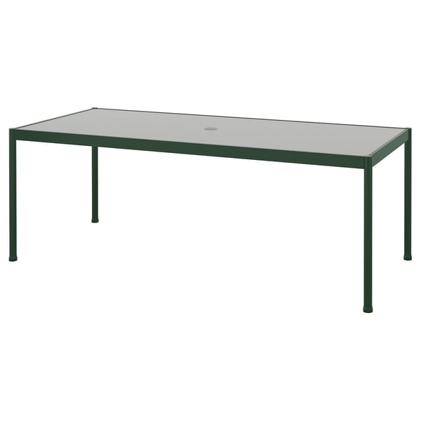SEGERÖN utomhusbord: grön metallram, rektangulär glasskiva, minimalistisk design.