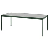 SEGERÖN utomhusbord: grön metallram, rektangulär glasskiva, minimalistisk design.