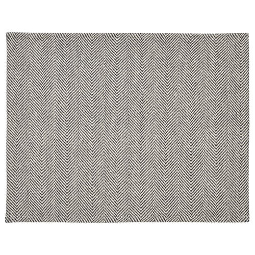 En rektangulär SILVERARV bordstablett i svart och vitt, med fiskbensmönster, tillverkad av bomull och jute.