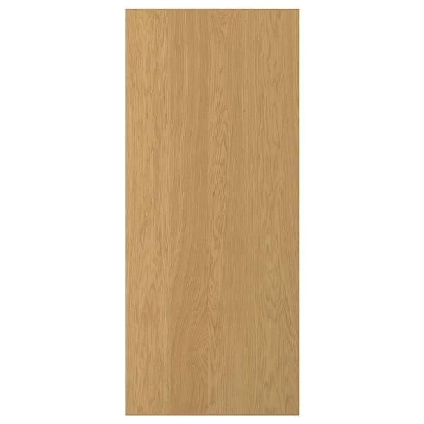 SINNARAB, en ljusbrun trädörr. Den är gjord av ekfanér med en massiv ekkant, med en elegant rektangulär design.