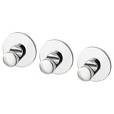 Tre kromade, runda krokar med självhäftande tejp på baksidan för väggmontering. Modern, minimalistisk design.