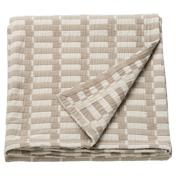 Ikea SKOGSKOVALL pläd, vikt. Beige och vit rutig, rektangulär form, bomull.
