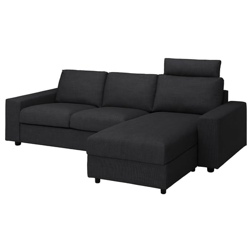 En mörkgrå VIMLE sektionssoffa med schäslong, modulär design och nackstöd.