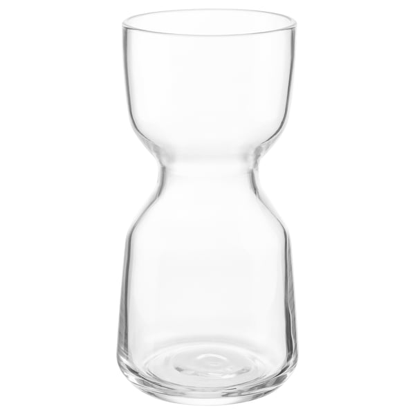 En genomskinlig VINTERDRÄKT glasvas. Den är gjord av klart glas, har en timglasform med släta linjer, perfekt för att visa blommor.