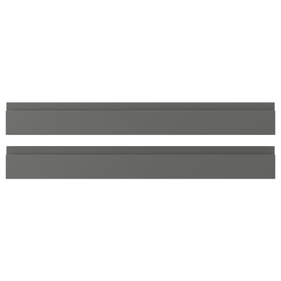 Två horisontella mörkgrå rektangulära lådor med elegant, minimalistisk design, inga synliga handtag.