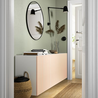 Modern entryway with BESTÅ sideboard, mirror, and decor.
