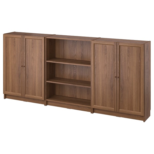 A BILLY bookcase in brown wooden finish with a combination of cabinet doors and open shelves.