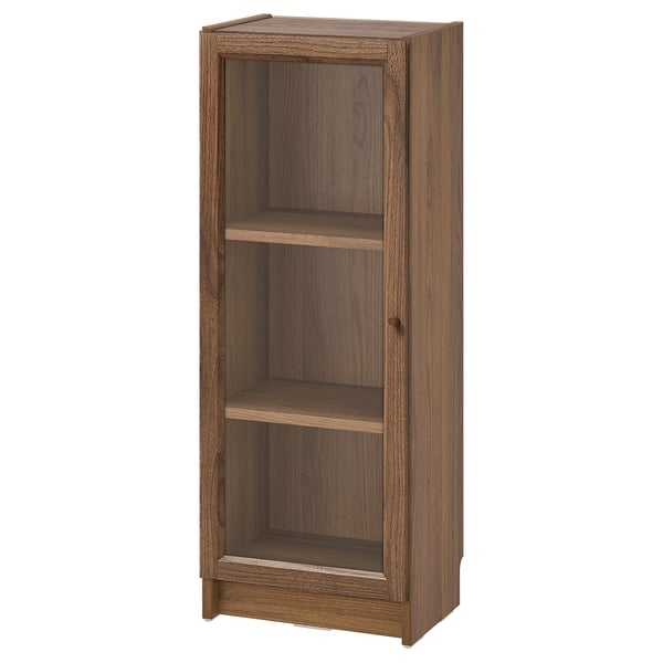 The BILLY bookcase is a wooden storage unit with three shelves and glass panels, ideal for organising small spaces.