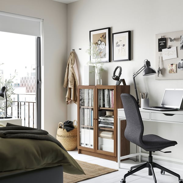 Modern home office with BILLY bookcase, office chair, desk & decor.