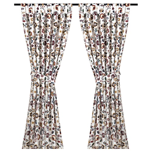 BRUNÖRT floral curtains, white with red, yellow, and blue flowers. Made from 100% cotton with tab headings.