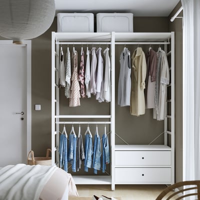 ELVARLI white modular wardrobe with shelves and drawers, sleek and modern design.