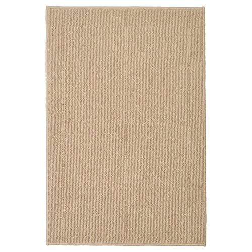 FINTSEN beige bath mat, rectangular, textured, recycled polyester.