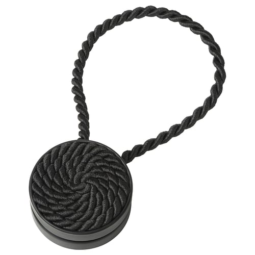 Black magnetic curtain tie-back, rope-like design with circular magnetic ends, decorative and practical.