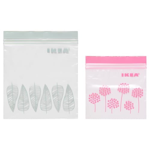 Two IKEA ISTAD resealable bags, one with green leaf designs, the other with pink floral patterns. Both are transparent with double seals.