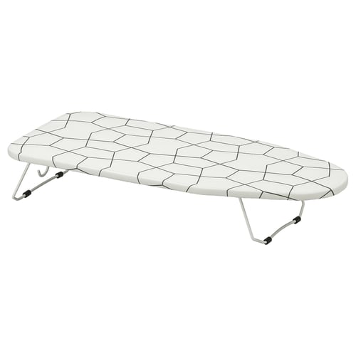 A JÄLL ironing board. Its white with a hexagon-patterned mesh surface. The board has foldable legs and hooks for wall mounting.
