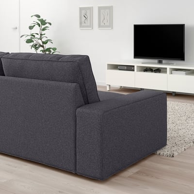 Dark grey KIVIK sofa, modern design, spacious & deep cushions, large tv unit, cosy living room setup.