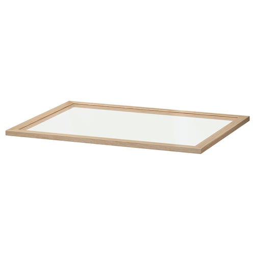 A KOMPLEMENT glass shelf, rectangular, light brown wood frame, clear glass centre, ideal for displaying items.